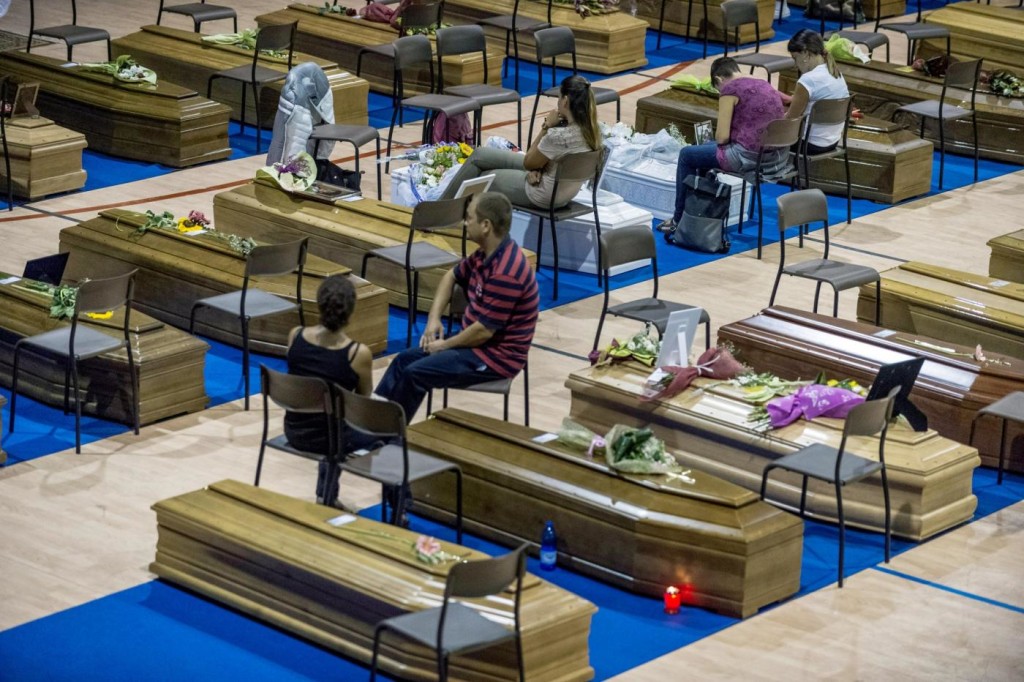 Coffins of some of the victims of the earthquake in central Italy are seen inside a gym in Ascoli Piceno, August 26, 2016. REUTERS/Adamo Di Loreto FOR EDITORIAL USE ONLY. NO RESALES. NO ARCHIVES.